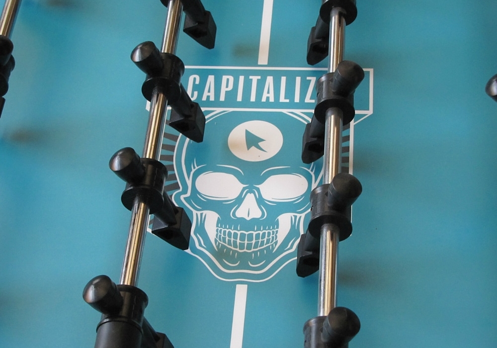 Company Logo playfield on Warrior Foosball Table for Capitalize